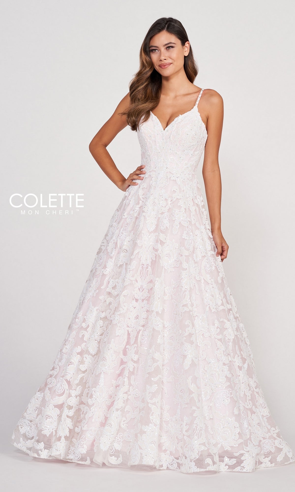 A woman models the CL2008 Colette White & Pink Lace Long Prom Dress, featuring a sleeveless design, fitted bodice, and flared skirt, standing against a plain light background.